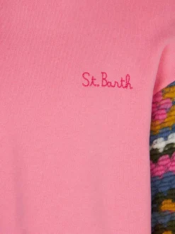 Maglia da bambina rosa con maniche all'uncinetto